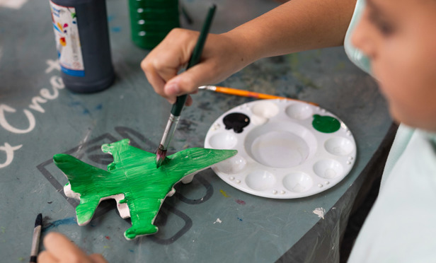 Finlake Boy Painting A Plane