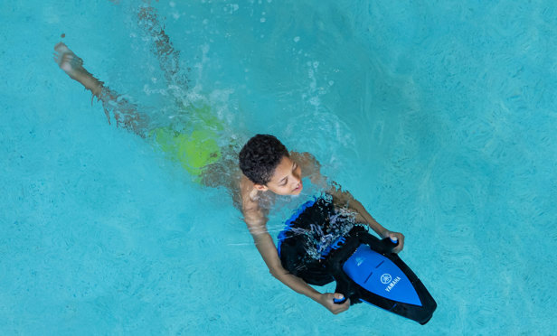 Young boy on seascooter at Finlake swimming pool