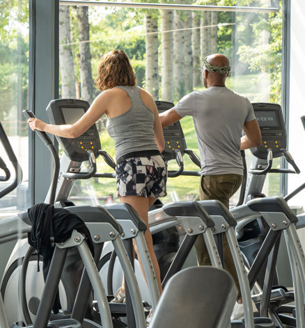 Couple using cross-training machines at Finlake gym
